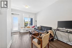 Waterdown townhouse for rent - A living room with a couch, chair, and television.