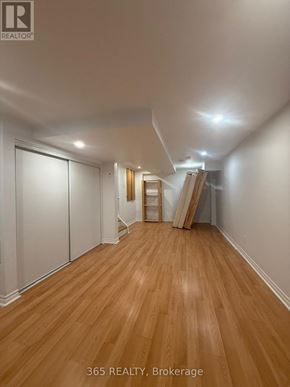 Milton (Cl Clarke) apartment for rent - A room with wooden flooring and white walls, with a ladder and a white closet door.