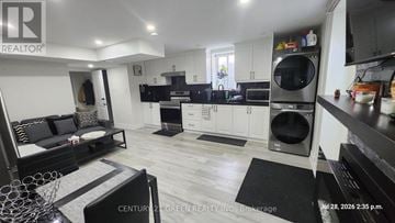 Milton (Fo Ford) apartment for rent - A well-lit kitchen with a dining area and a living room.