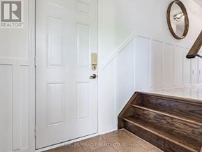 Milton (Ha Harrison) townhouse for rent - A white door with a wooden staircase leading up to it.