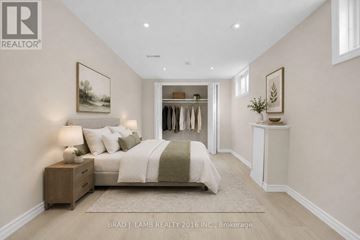 Barrie (Allandale Heights) apartment for rent - A bedroom with a bed, nightstand, and a painting on the wall.