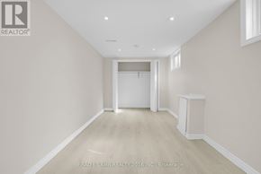Barrie (Allandale Heights) apartment for rent - A spacious room with a doorway leading to another room.