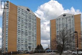 Mississauga (Hurontario) condo for rent - Two identical buildings stand side by side with a cloudy sky in the background.