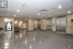 Mississauga (Hurontario) condo for rent - A spacious lobby with marble flooring and a reception desk.