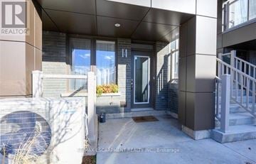 Hamilton (Waterdown) townhouse for rent - The image shows the front of a building with the number 14 on it.