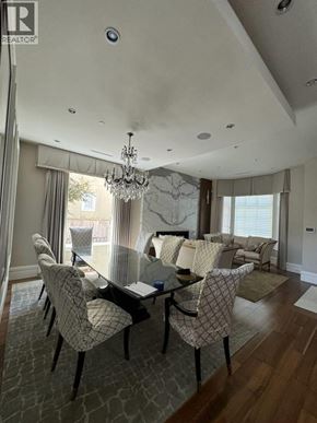 Vancouver apartment for rent - A dining room with a glass table and chairs.