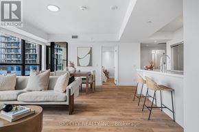 Toronto (Thorncliffe Park) condo for rent - A living room with a couch, chairs, and a coffee table.