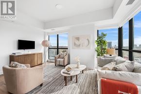 Toronto (Thorncliffe Park) condo for rent - A living room with a large window and a flat screen TV.