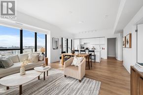 Toronto (Thorncliffe Park) condo for rent - A spacious living room with a large window overlooking the city.