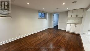 Toronto (Yorkdale-Glen Park) apartment for rent - A spacious room with wooden flooring and white walls.