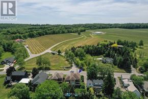 Lincoln (Lincoln-Jordan/Vineland) apartment for rent - A bird's eye view of a residential area with houses and a large open field.