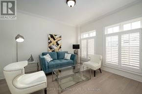 Lincoln (Lincoln-Jordan/Vineland) apartment for rent - A living room with a blue couch, a white chair, and a glass coffee table.