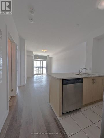 Hamilton (Waterdown) condo for rent - A kitchen with a dishwasher and a sink.