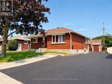 Ottawa apartment for rent - A residential area with houses and a tree in the foreground.