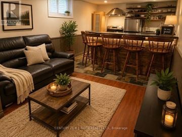 Barrie (Allandale Heights) apartment for rent - A living room with a bar area in the background.