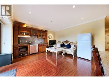 West Vancouver apartment for rent - A living room with a white sofa and wooden floors.