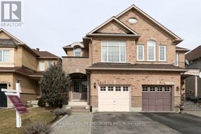 Mississauga (Churchill Meadows) apartment for rent - A large brick house with a garage is for sale.