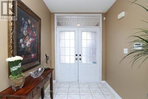 Mississauga (Churchill Meadows) apartment for rent - A white double door with a glass panel is flanked by two windows.