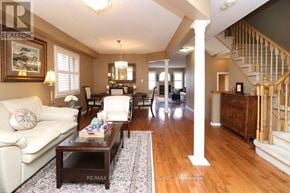 Mississauga (Churchill Meadows) apartment for rent - A living room with a white couch and a coffee table.
