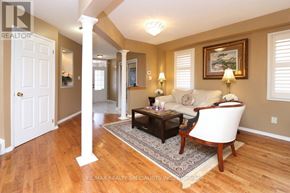 Mississauga (Churchill Meadows) apartment for rent - A living room with a white chair and a brown coffee table.