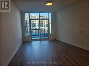 Mississauga (Central Erin Mills) condo for rent - A room with a view of a building outside through the window.
