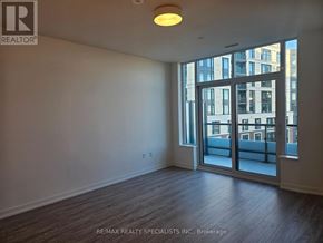 Mississauga (Central Erin Mills) condo for rent - A room with a large window and a sliding glass door.