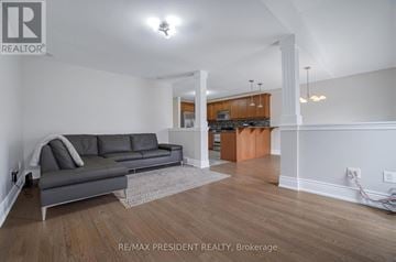 London North (North I) apartment for rent - A living room with a grey couch and a wooden floor.