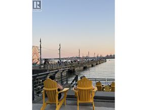 North Vancouver apartment for rent - Two yellow chairs are on a dock with a pier in the background.