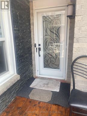 Brampton (Northwood Park) apartment for rent - A door with a glass window and a black handle.