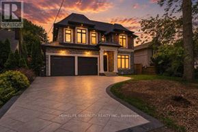 Mississauga (Lakeview) apartment for rent - A house with a driveway in front of it.