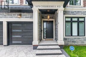 Mississauga (Lakeview) apartment for rent - The front of a house at 1078 Cherriebell Rd with a black door and steps leading to it.