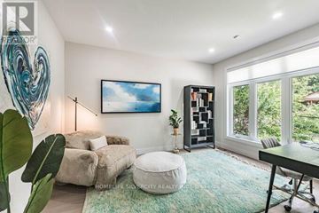 Mississauga (Lakeview) apartment for rent - A living room with a large window and a painting on the wall.