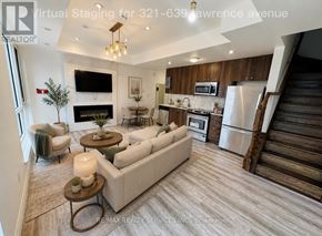 Toronto (Englemount-Lawrence) townhouse for rent - A modern living room with a staircase on the right side.