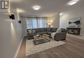 Whitby (Downtown Whitby) apartment for rent - A living room with a grey sofa and a coffee table.