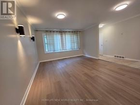 Whitby (Downtown Whitby) apartment for rent - A room with wooden flooring and a window with curtains.