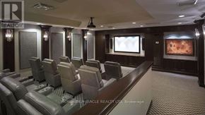 Vaughan (Concord) condo for rent - A home theater with a row of seats and a screen.