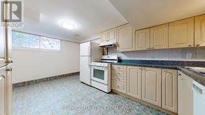 Richmond Hill (Harding) apartment for rent - A kitchen with a white oven and cabinets.