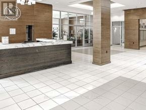 Mississauga (City Centre) condo for rent - A reception area with a brown and white color scheme.