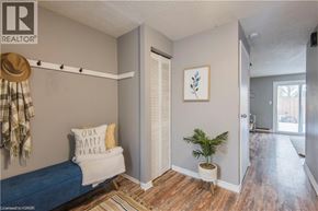 Kitchener townhouse for rent - A bedroom with a bed, pillow, and a potted plant.