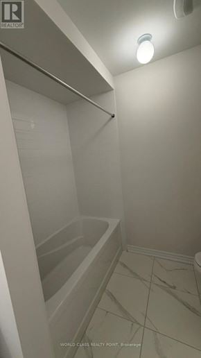 Kawartha Lakes (Lindsay) townhouse for rent - A white bathroom with a walk-in shower.