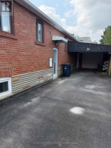 Toronto (Eglinton East) apartment for rent - A red brick building with a number 34 on the wall.