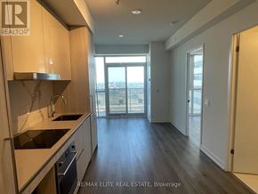 Vaughan (Vaughan Corporate Centre) condo for rent - A kitchen with a sink, stove, and cabinets.