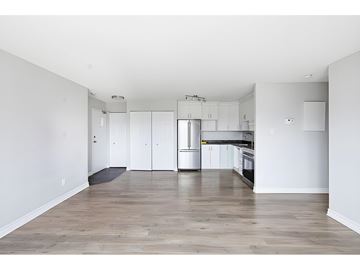 Gatineau (Aylmer) condo for rent - A kitchen with white cabinets and a wooden floor.