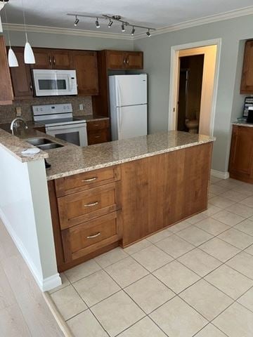 Burnaby apartment for rent - A kitchen with a white refrigerator and wooden cabinets.