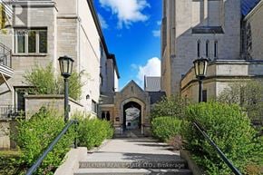 Ottawa condo for rent - A stone archway leads to a building entrance.
