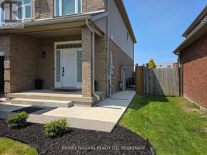 Niagara Falls (Forestview) apartment for rent - A house with a white door and a small front yard.