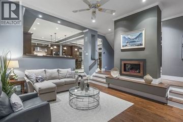 West Vancouver apartment for rent - A living room with a grey couch and a fireplace.