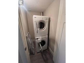 Coquitlam apartment for rent - A washing machine and dryer in a small laundry room.