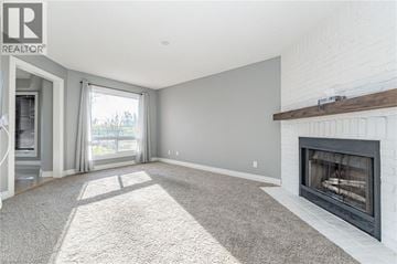 Cambridge apartment for rent - A living room with a fireplace and a carpet on the floor.