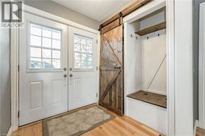 Cambridge apartment for rent - A white door with a glass window is on the left and a white door with a wooden door handle is on the right.